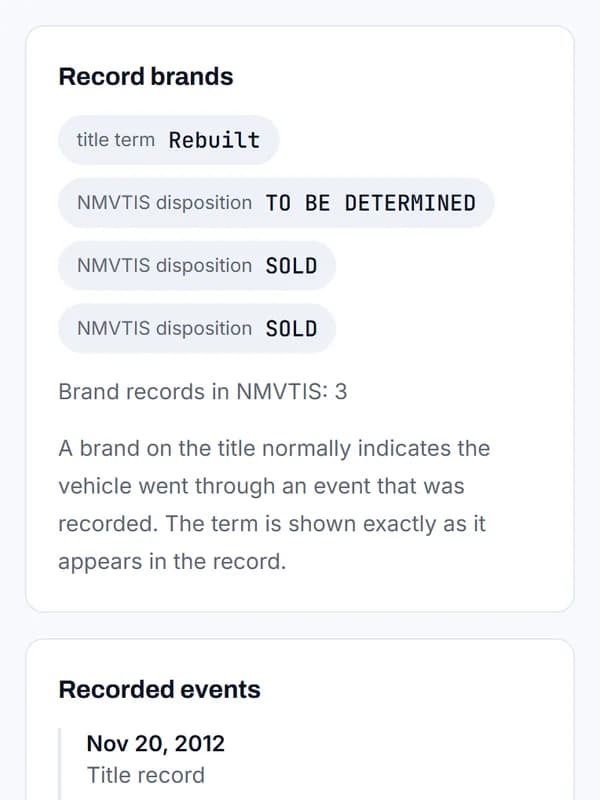 The title's record brands: the term Rebuilt and three NMVTIS dispositions, TO BE DETERMINED, SOLD and SOLD.